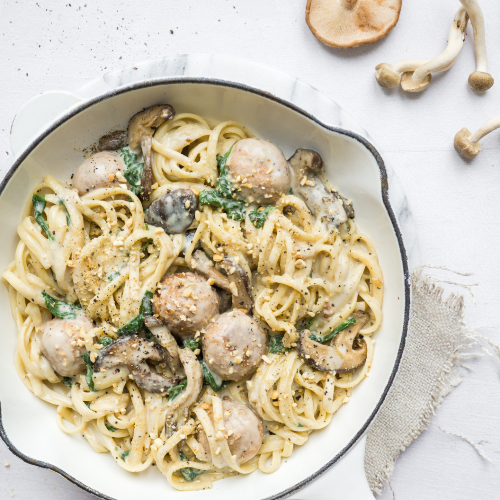 Cheezy pasta with meatballs and mushrooms