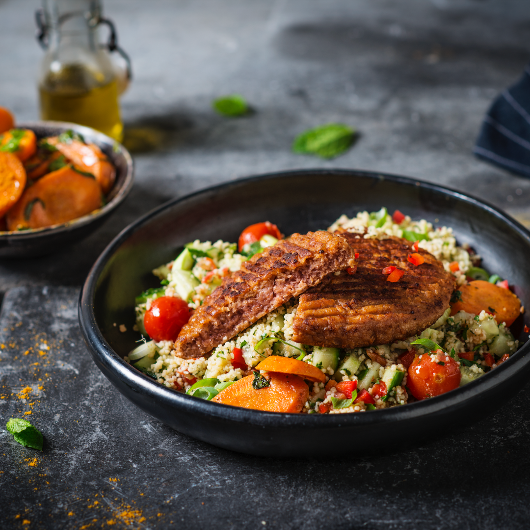 Greenway gourmet burger with Moroccan carrots and couscous salad